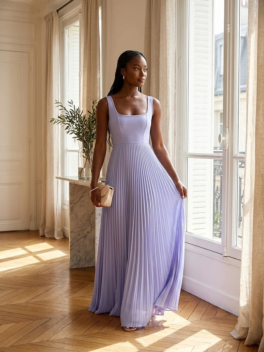 Wedding guest dresses — lavender pleated maxi dress in a Paris apartment