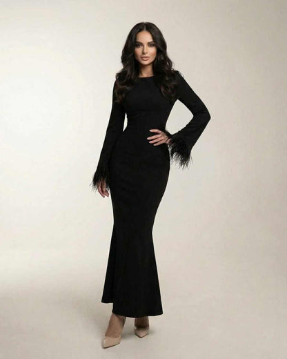 Valencia Maxi Dress by Lauven, black long sleeve mermaid gown with feather cuffs, elegant and sophisticated design.