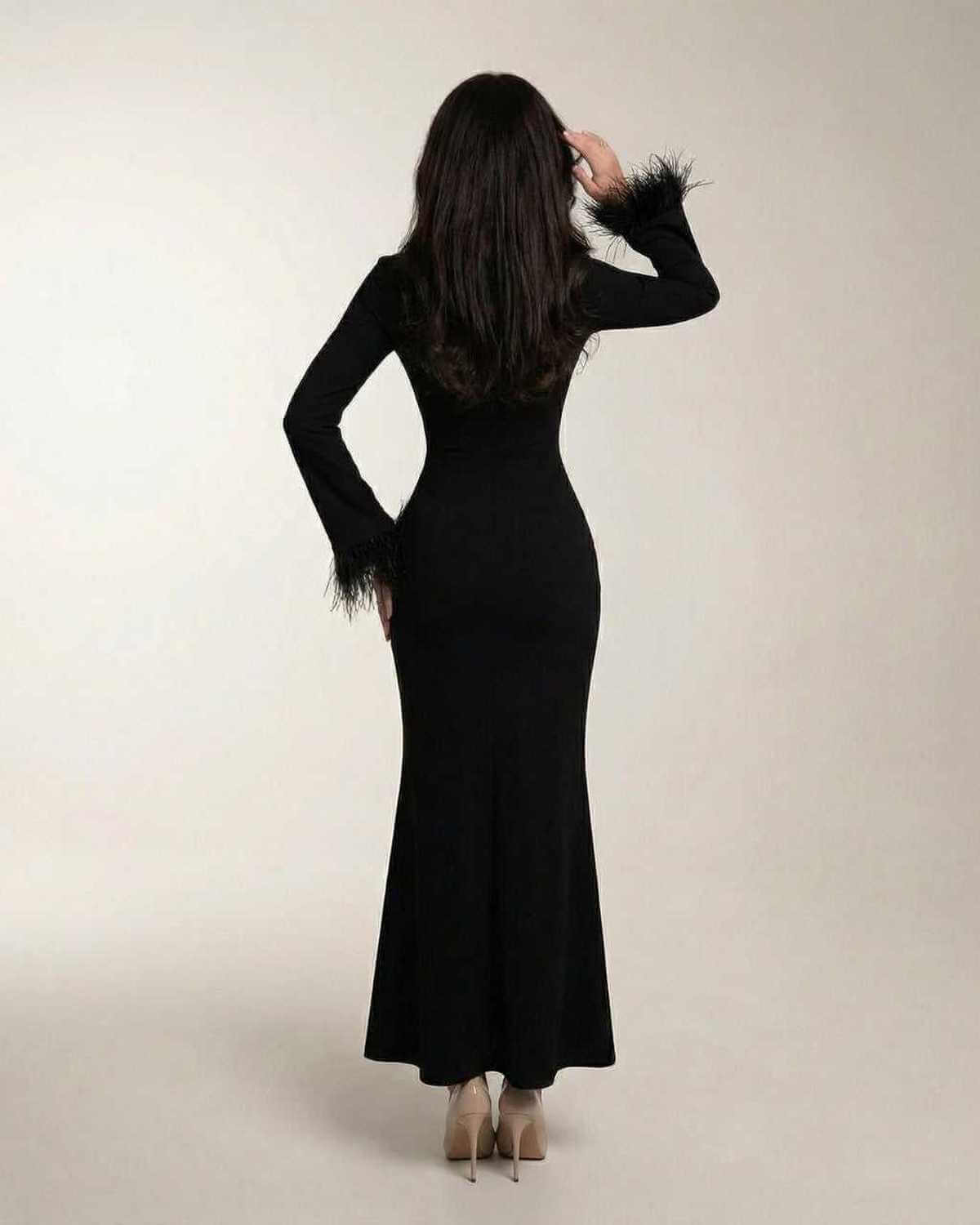 Valencia Maxi Dress by Lauven - Black long sleeve mermaid dress with feather cuff sleeves from the back.