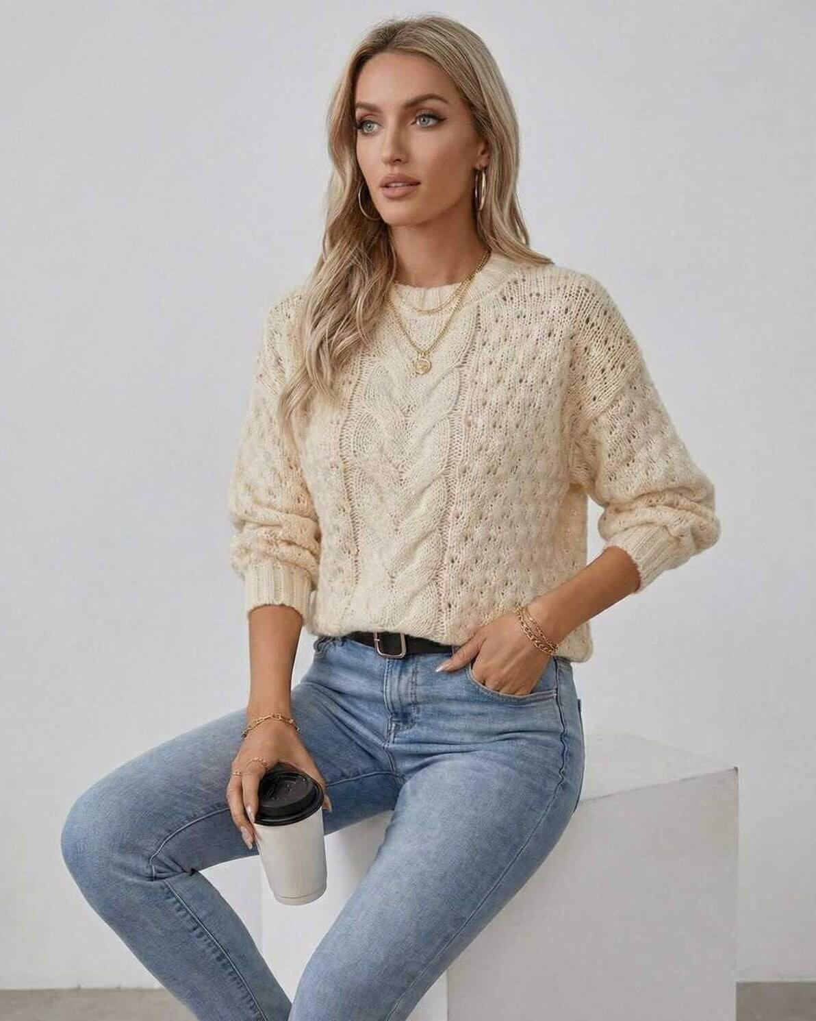 Arden Sweater by Lauven – Women's cream cable knit sweater in a stylish autumn outfit with coffee.