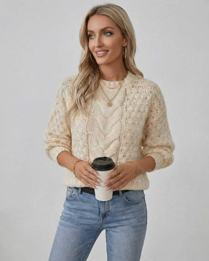 Arden Sweater by Lauven – Women's cream cable knit pullover worn with a coffee cup in hand.