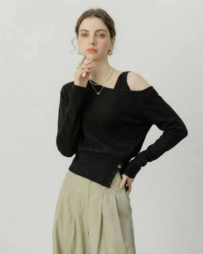 Monaco Pullover by Lauven – Black Off Shoulder Pullover with Asymmetric Knit Detail in a stylish setting.