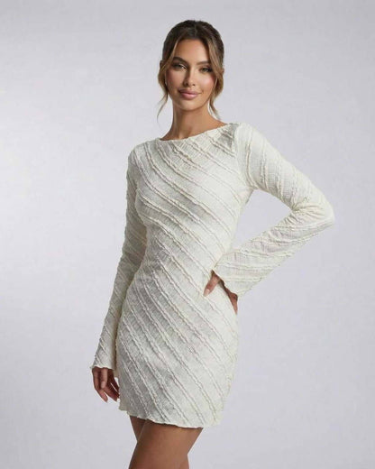 Sienna Mini Dress by Lauven - White long sleeve A-line dress with textured finish and structured drape.