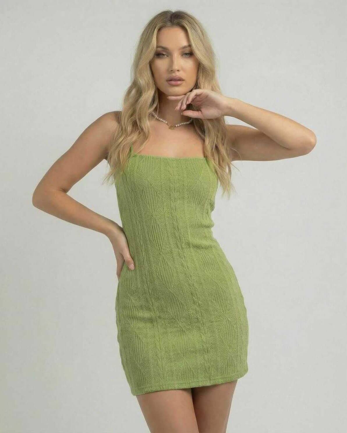 Verona Mini Dress by Lauven - Green bodycon mini dress with open back and textured finish on model.