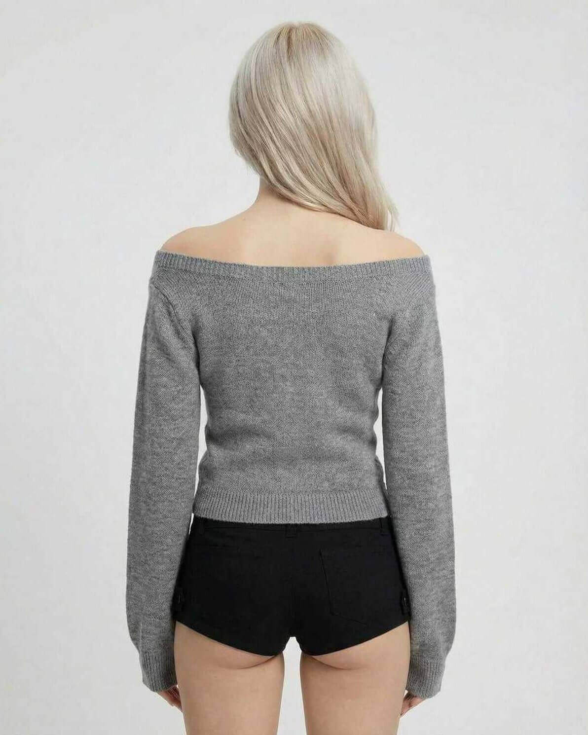 Back view of a woman wearing a grey off-shoulder Sienna Sweater from Lauven, showcasing its slim fit design.