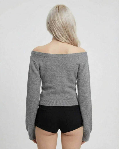 Back view of a woman wearing a grey off-shoulder Sienna Sweater from Lauven, showcasing its slim fit design.