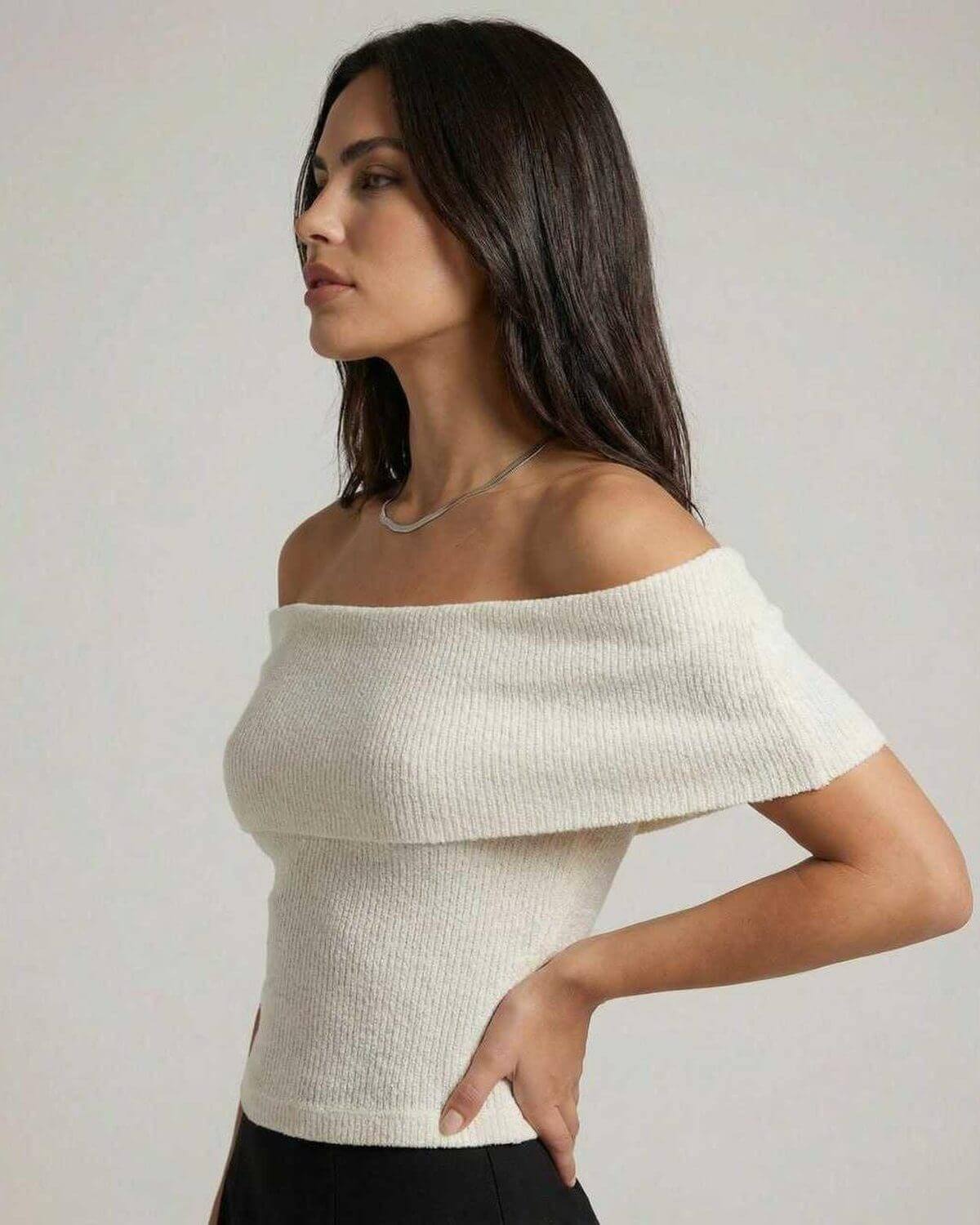 Women wearing Lauven's Monaco Top, an elegant off shoulder knit top in a minimalist style.