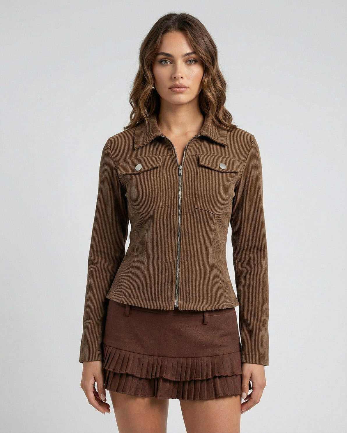 Florence Jacket by Lauven - Women’s brown corduroy jacket with zipper and tailored fit, styled with a pleated skirt.