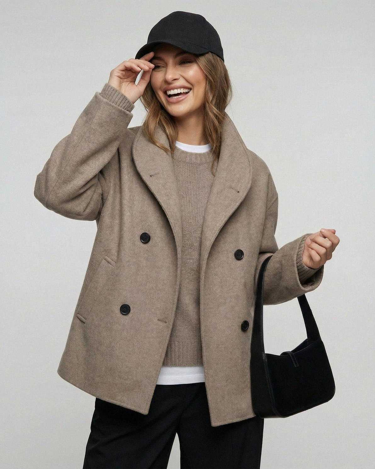 Woman wearing a Verona Jacket by Lauven, showcasing a stylish oversized look for business and fall fashion.