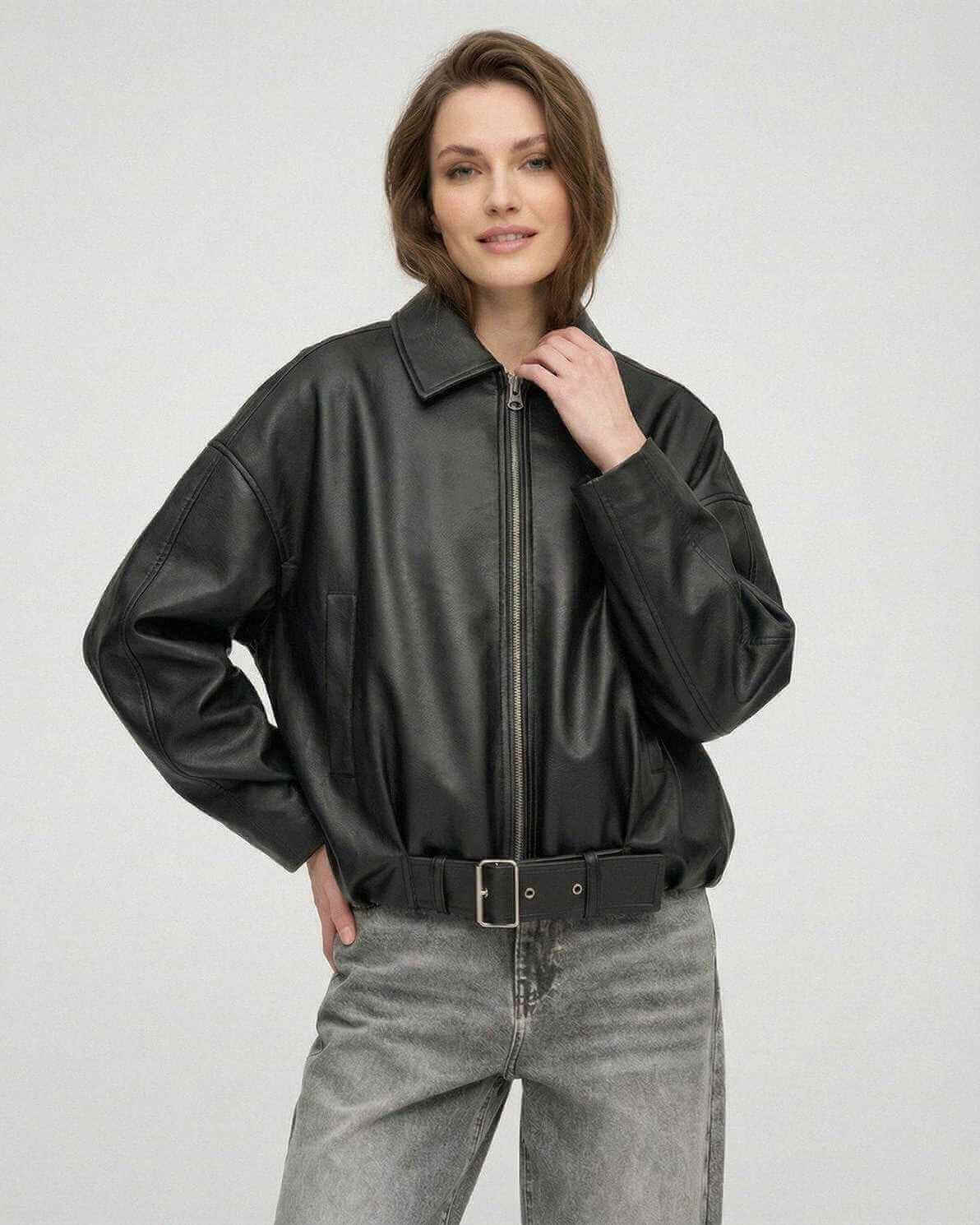 Women wearing a Black Belted Jacket by Lauven, showcasing an oversized silhouette and structured lapel collar.