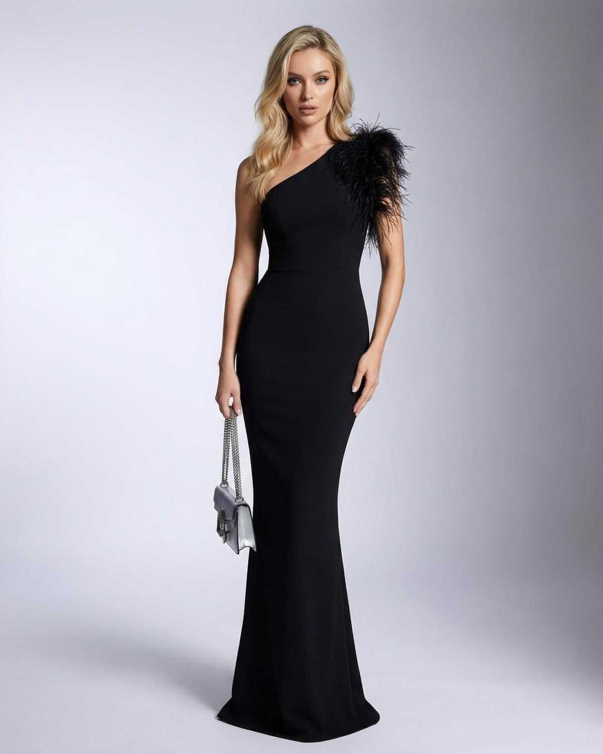 Noirelle Maxi Dress by SLIMONA featuring one shoulder feather detail and mermaid silhouette in elegant black.