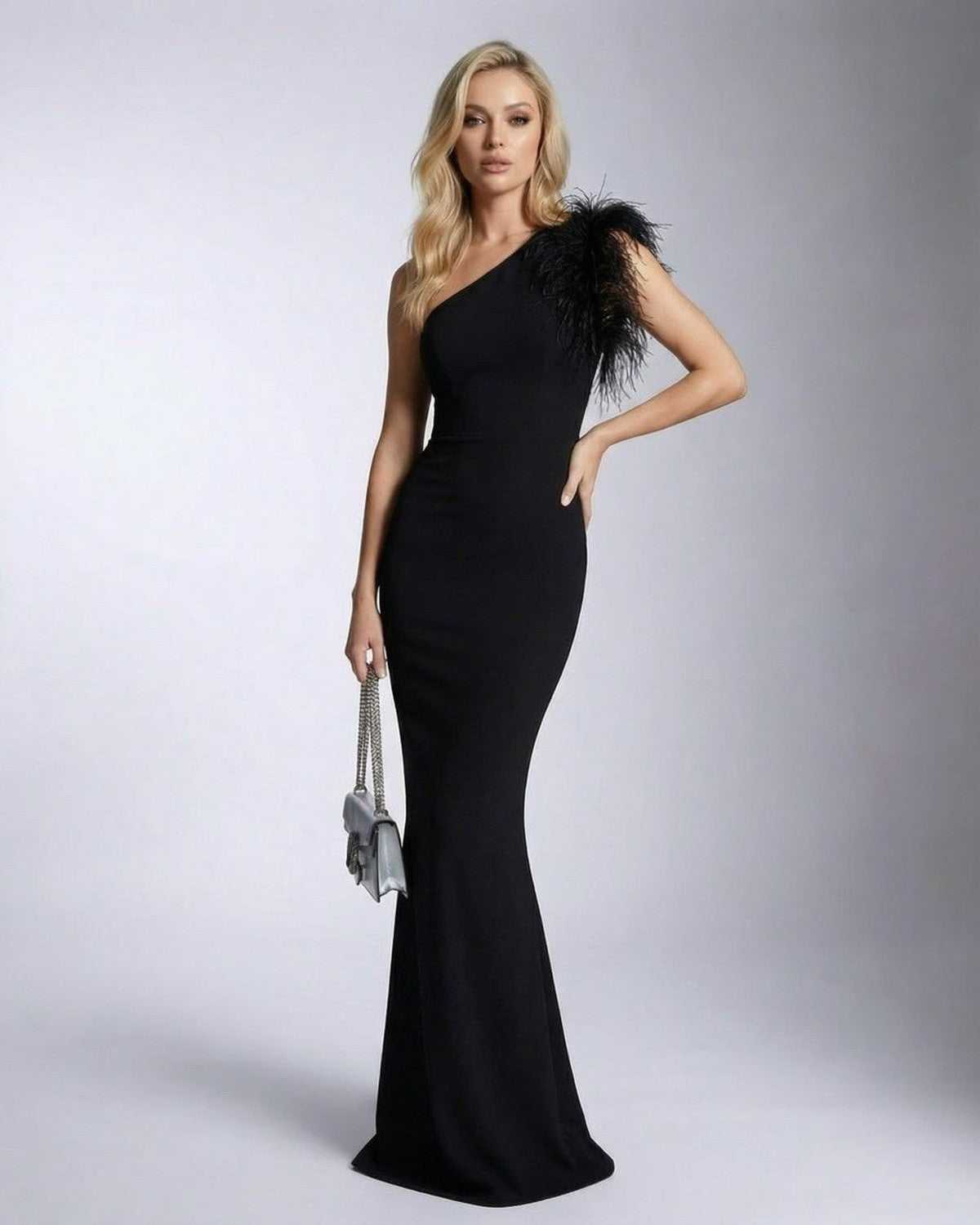 Noirelle Maxi Dress by SLIMONA - Elegant black one shoulder design with feather detail and mermaid silhouette.