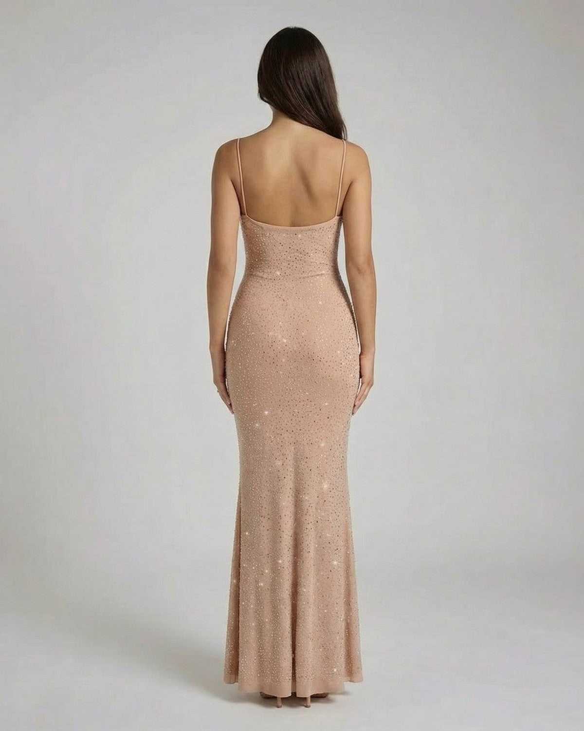 Back view of the SLIMONA Celeste Maxi Dress, a sequin bodycon gown with spaghetti straps and a flattering silhouette.