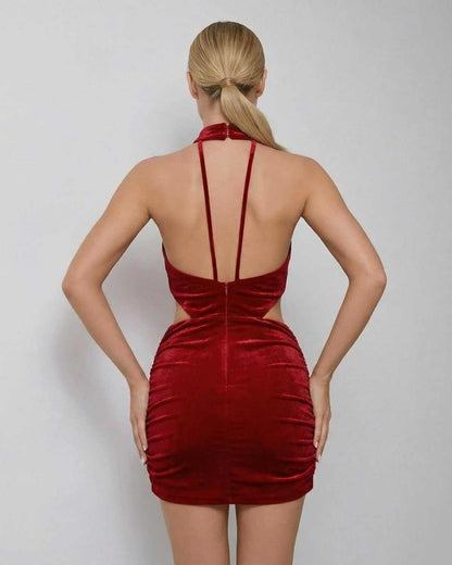 Valencia Mini Dress by SLIMONA, red velvet bodycon mini dress featuring a sleeveless halter neck and stylish back design.