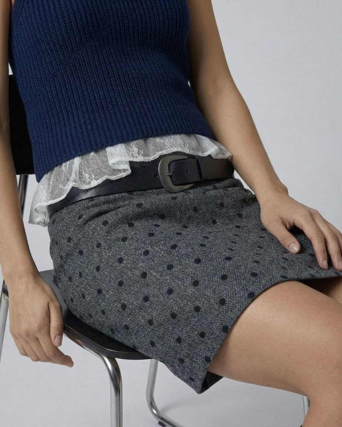 Lyra Mini Skirt by SLIMONA, showcasing polka dot bodycon fit with zip detail for a chic look.