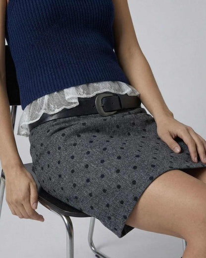Lyra Mini Skirt by SLIMONA, showcasing polka dot bodycon fit with zip detail for a chic look.