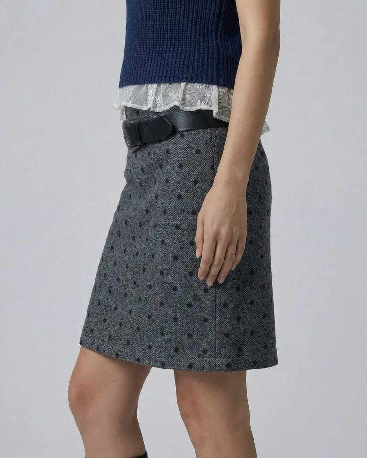 Lyra Mini Skirt by SLIMONA in polka dot bodycon fit, showcasing a sleek silhouette and zip detail for stylish everyday wear.