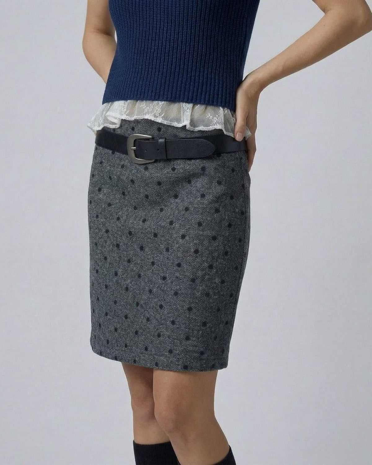Lyra Mini Skirt from SLIMONA featuring a polka dot bodycon fit and stylish belt detail for a chic look.