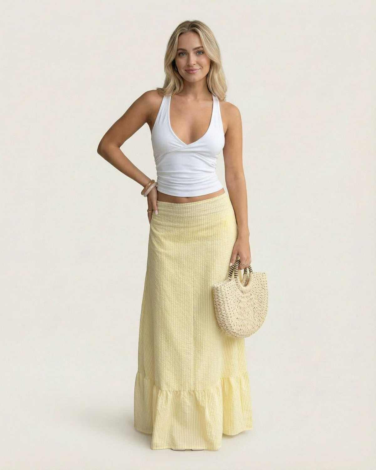 Solara Maxi Skirt by SLIMONA, featuring a flared silhouette and soft striped texture for summer elegance.