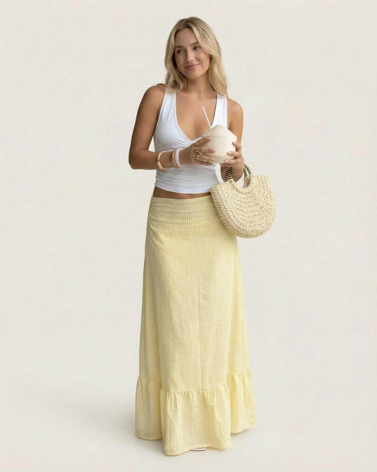 Solara Maxi Skirt by SLIMONA, flared silhouette with soft striped texture, ideal for summer elegance.