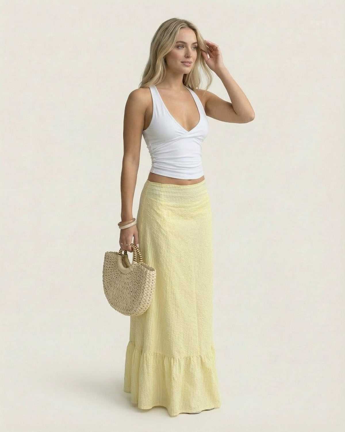 Solara Maxi Skirt by SLIMONA, featuring a flared silhouette and soft striped texture, perfect for summer elegance.