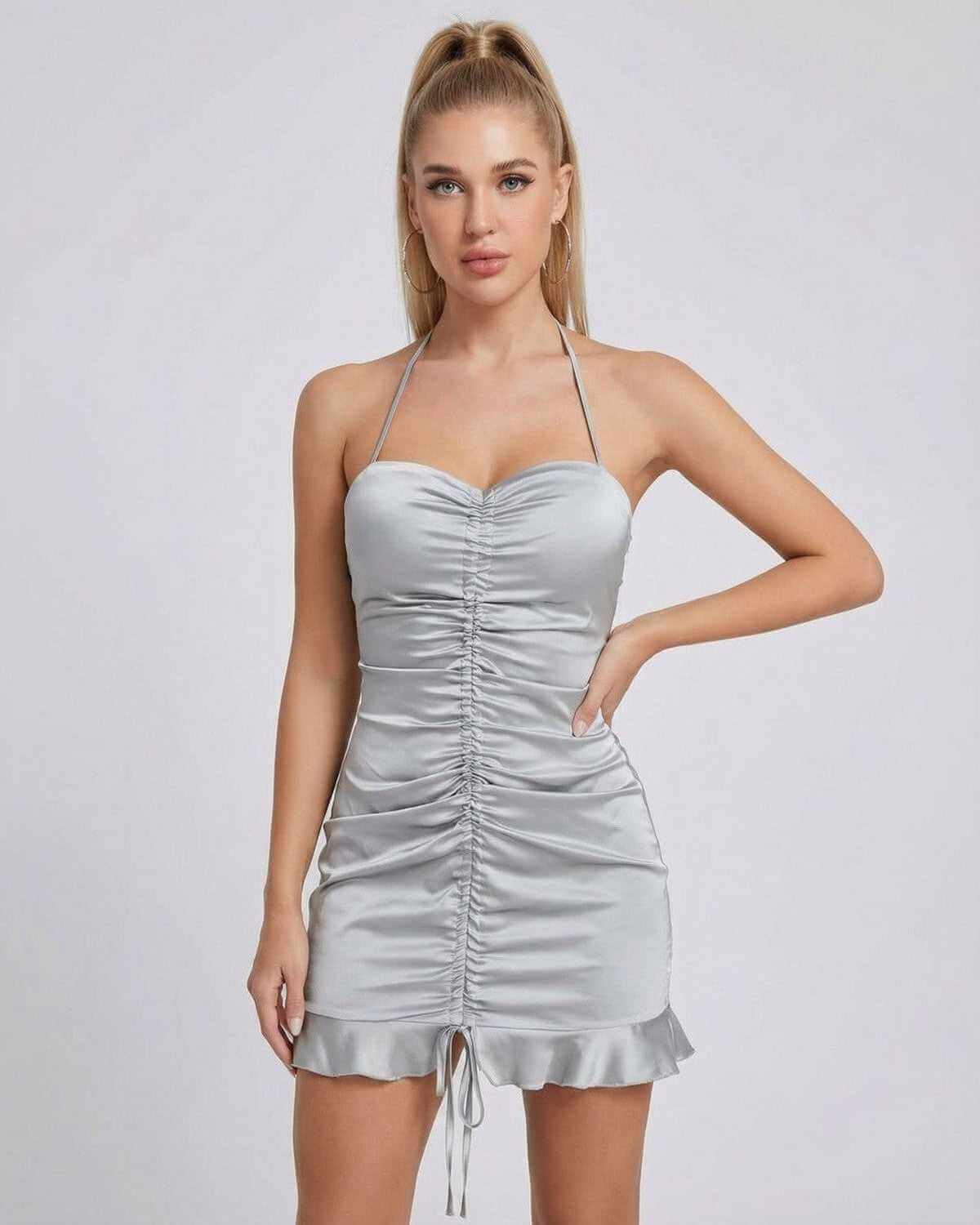 Celeste Mini Dress by SLIMONA features a satin finish, ruched design, and high-waist silhouette, perfect for chic outings.