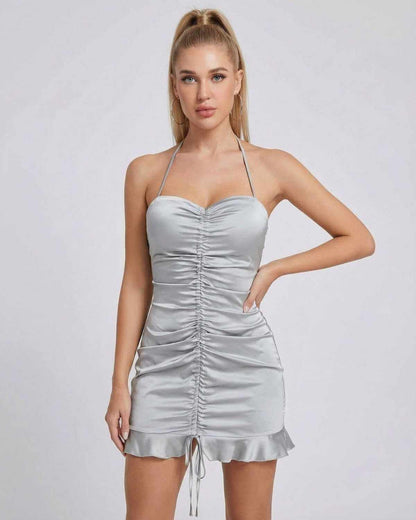 Celeste Mini Dress by SLIMONA features a satin finish, ruched design, and high-waist silhouette, perfect for chic outings.
