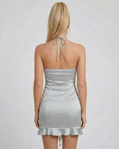 Celeste Mini Dress by SLIMONA, showcasing a sleek satin finish and ruched high-waist silhouette from the back.