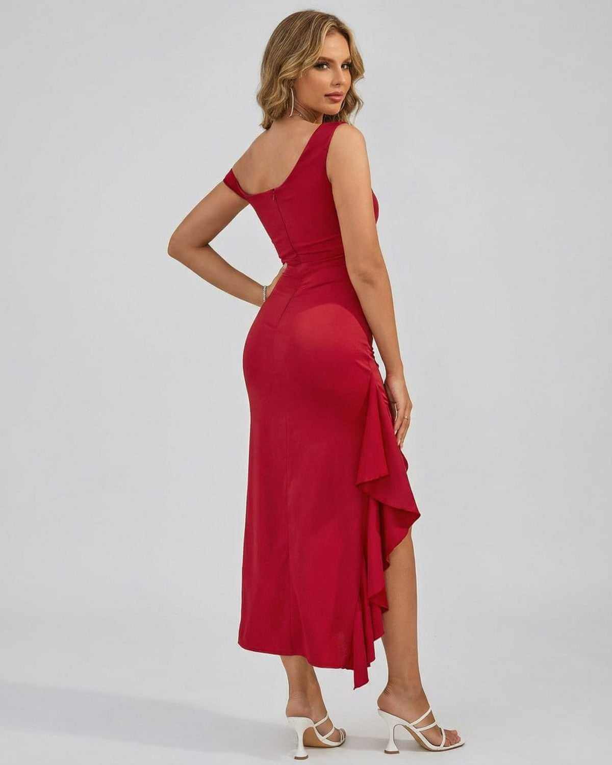 Valencia Midi Dress by SLIMONA, showcasing a red off-the-shoulder design with a flowing silhouette and elegant ruffle detail.