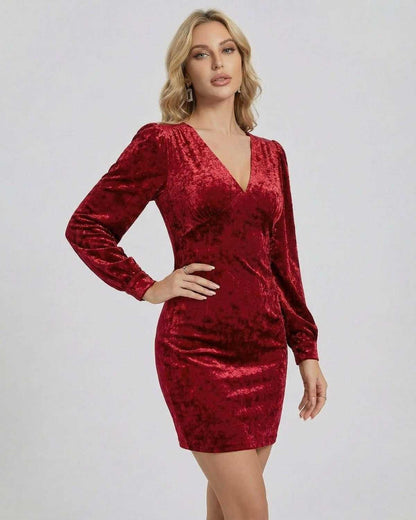 Valencia Mini Dress by SLIMONA in red velvet with long sleeves and V-neck design, perfect for special occasions.