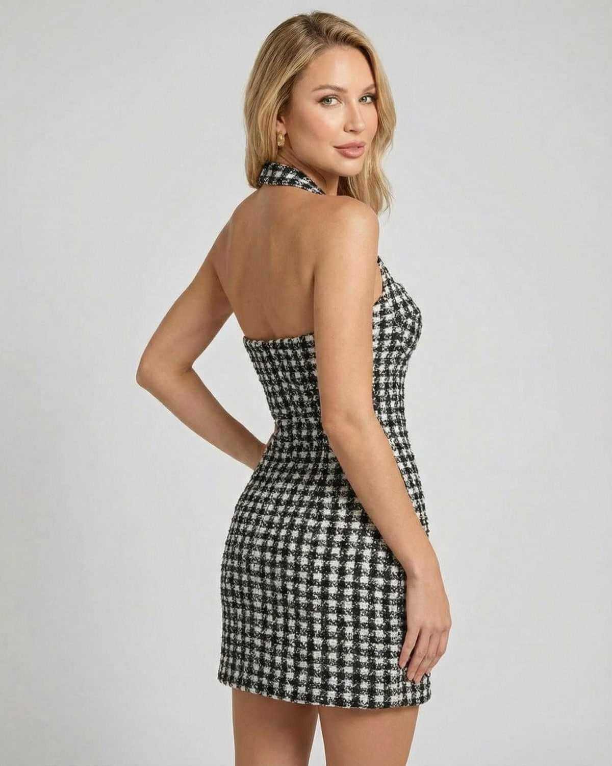 Aurelia Mini Dress in plaid design by SLIMONA, showcasing a halter neck and structured A-line silhouette.