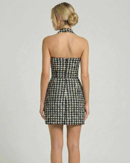 Back view of the Aurelia Mini Dress by SLIMONA, featuring a halter neck and plaid pattern, perfect for elegant occasions.