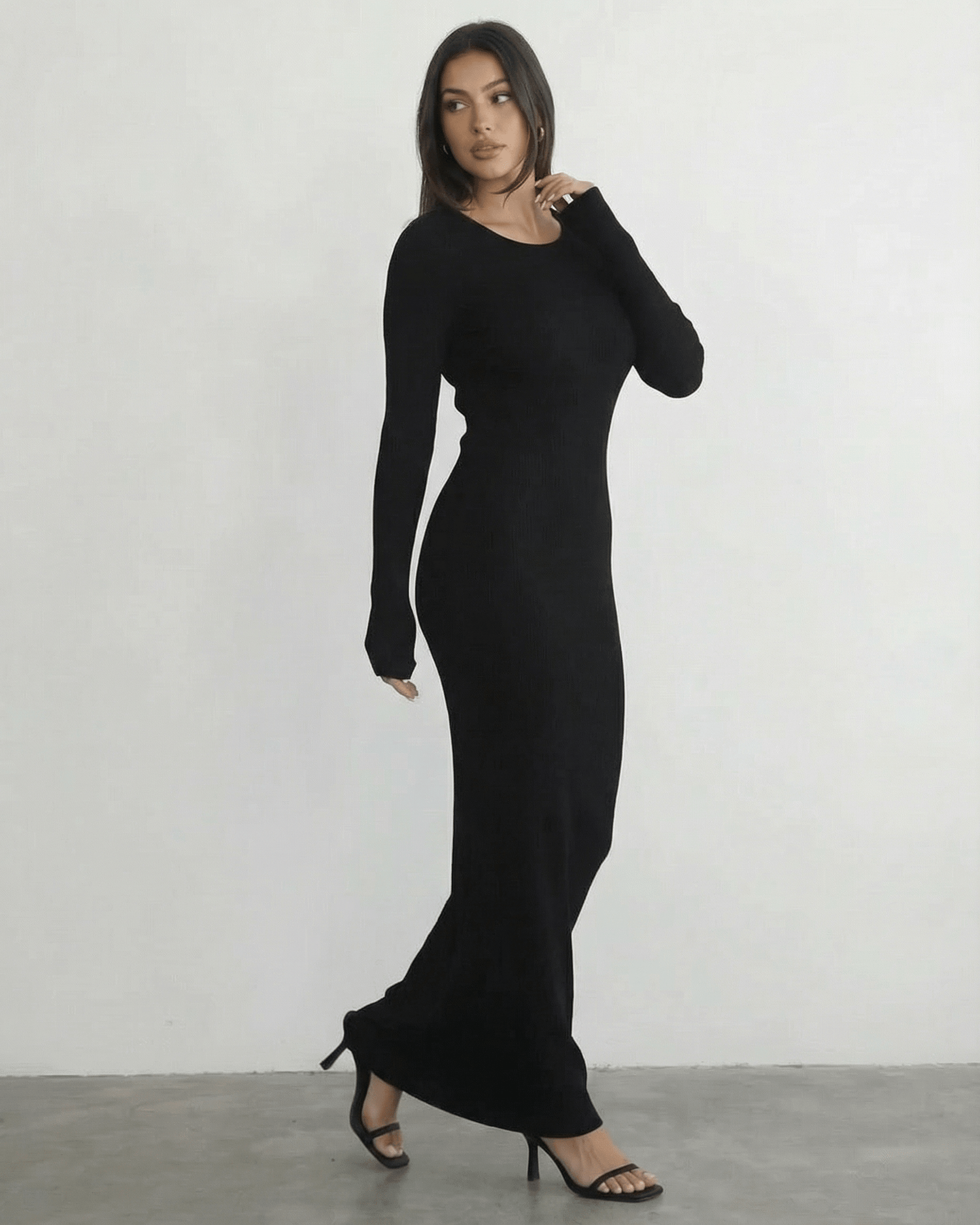 Nyx Maxi Dress by Lauven - Long sleeve black maxi dress with open back detail, showcasing its sleek silhouette.