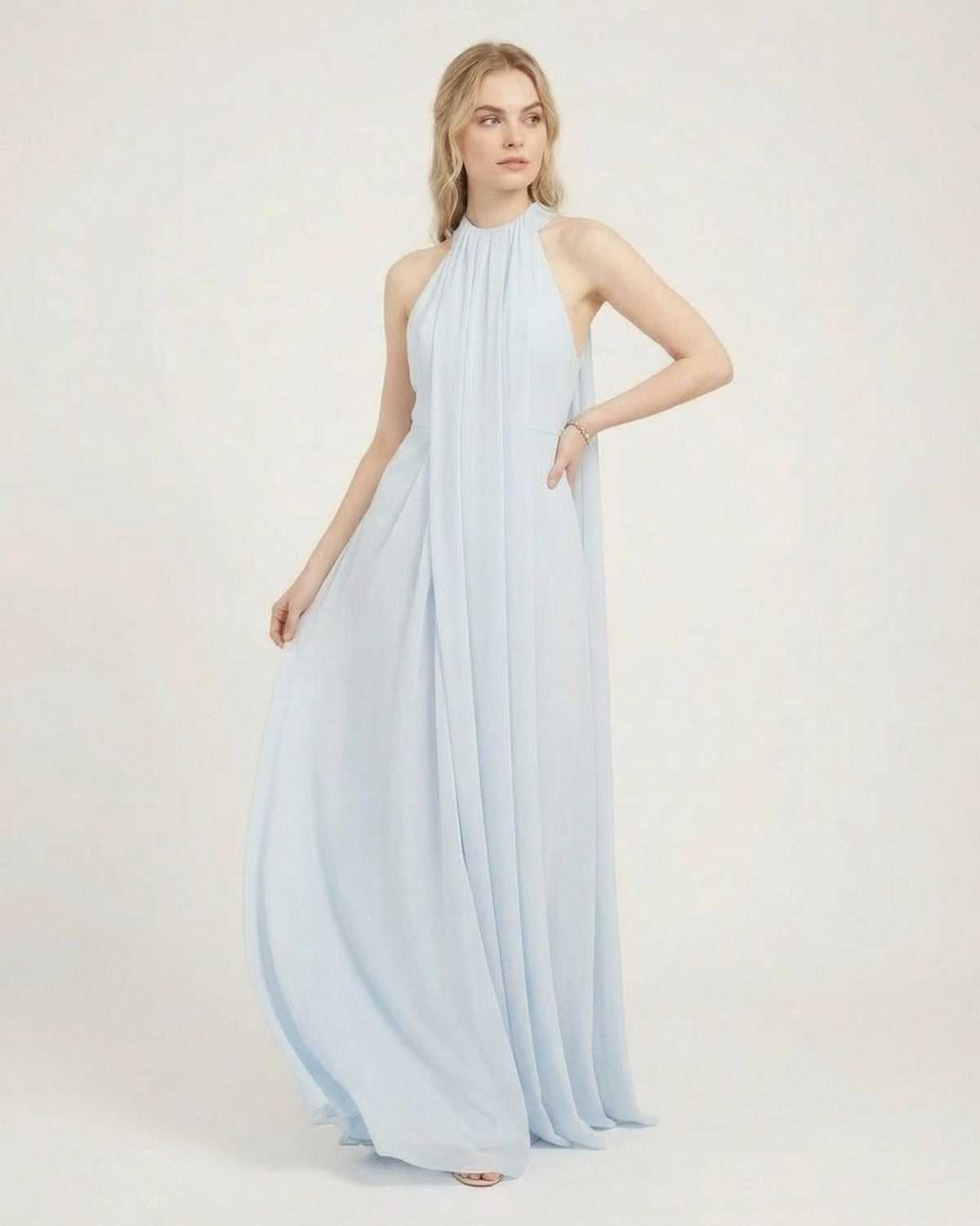 Aurelia Maxi Dress by SLIMONA, light blue halter neck sleeveless maxi dress with a loose fit and flowing silhouette.