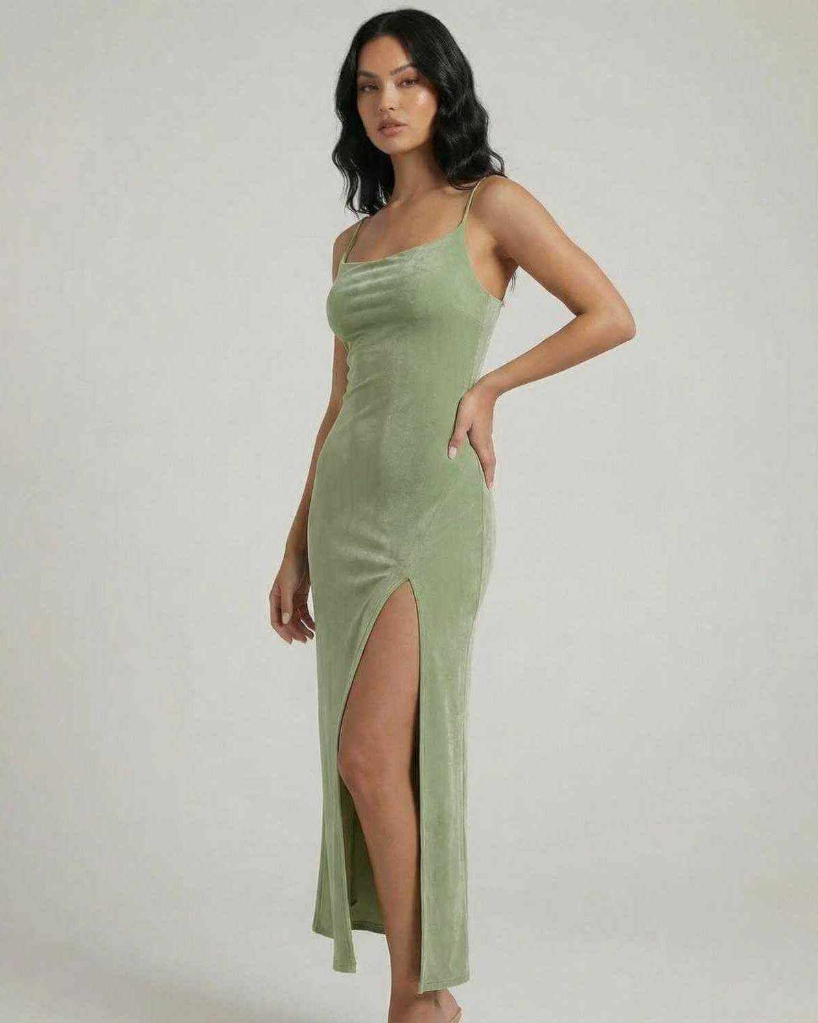 Aurelia Midi Dress by Lauven, featuring a square neck, slim fit, and asymmetrical slit in a soft green fabric.