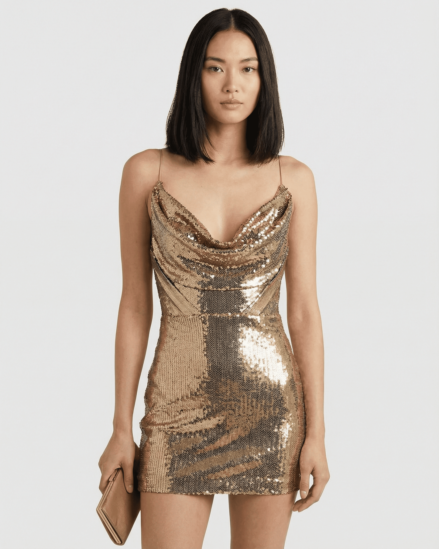 Aurelia Mini Dress by SLIMONA, a gold sequin V-neck mini dress with a high waist and elegant drape.