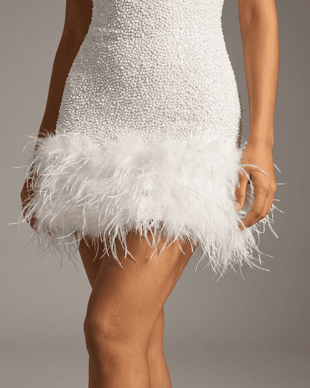 Bianca Mini Dress by SLIMONA featuring a white sequin design and fuzzy feather hem detail.
