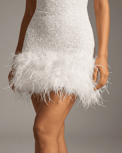 Bianca Mini Dress by SLIMONA featuring a white sequin design and fuzzy feather hem detail.