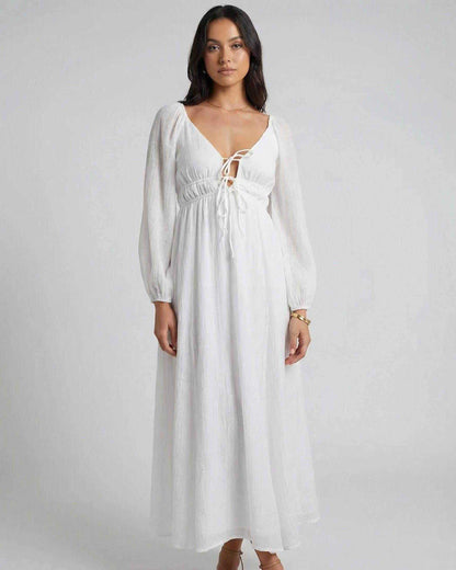 Calista Maxi Dress by Lauven featuring a deep V-neck, flowing silhouette and long sleeves, perfect for spring styling.