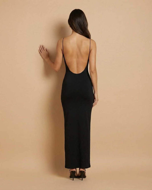 Calypso Maxi Dress by SLIMONA, black backless silhouette showcasing minimal elegance and fluid drape.
