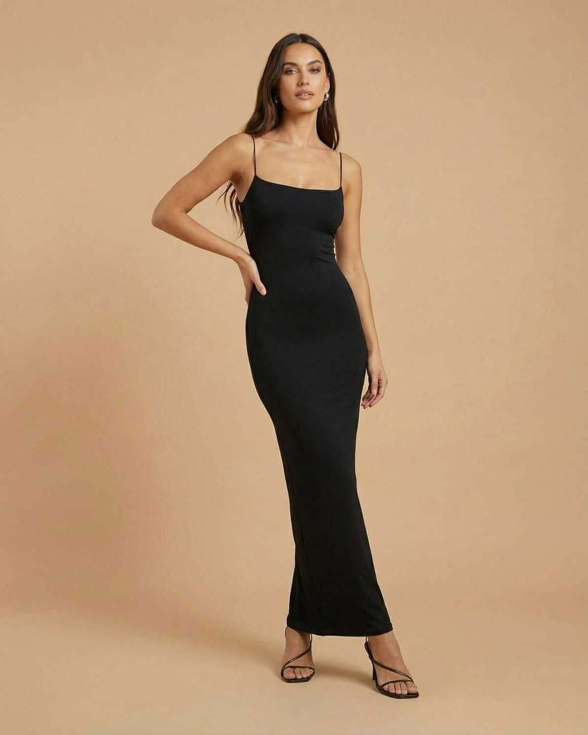 Calypso Maxi Dress by SLIMONA, a sleek black dress, perfect for formal occasions with a backless silhouette.