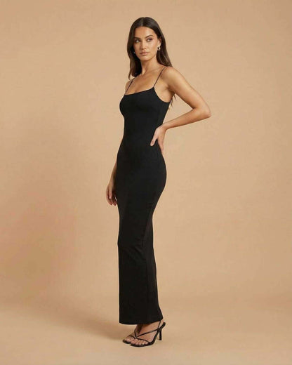 Calypso Maxi Dress by SLIMONA, a sleek black backless maxi dress in a streamlined silhouette.