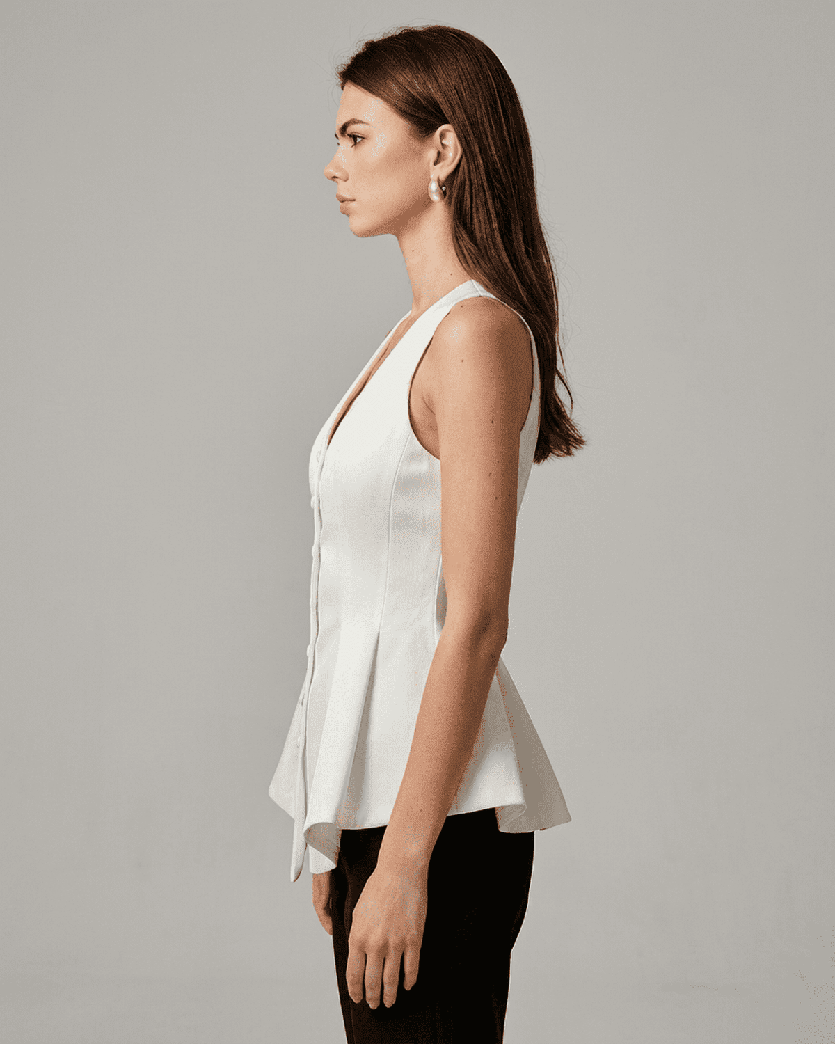 Celeste Blouse by SLIMONA, an elegant satin tailored sleeveless V-neck blouse in white, showcasing a refined silhouette.