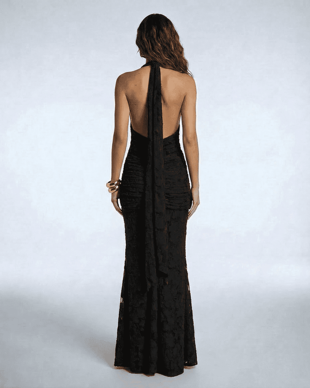 Celeste Maxi Dress by SLIMONA, showcasing a stylish back view with elegant tie-up detail in luxurious black fabric.