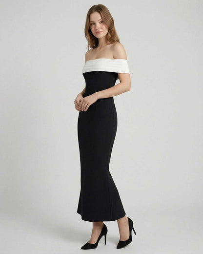 Celeste Maxi Dress by Lauven, elegant off-shoulder black dress with white neckline and flattering A-line silhouette.