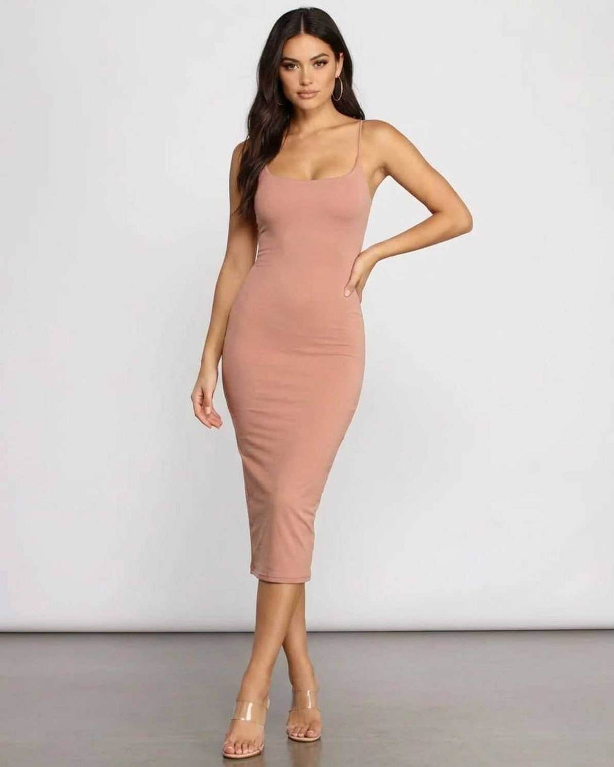 Celeste Midi Dress by SLIMONA featuring a figure-hugging silhouette and soft knit fabric for comfort and style.