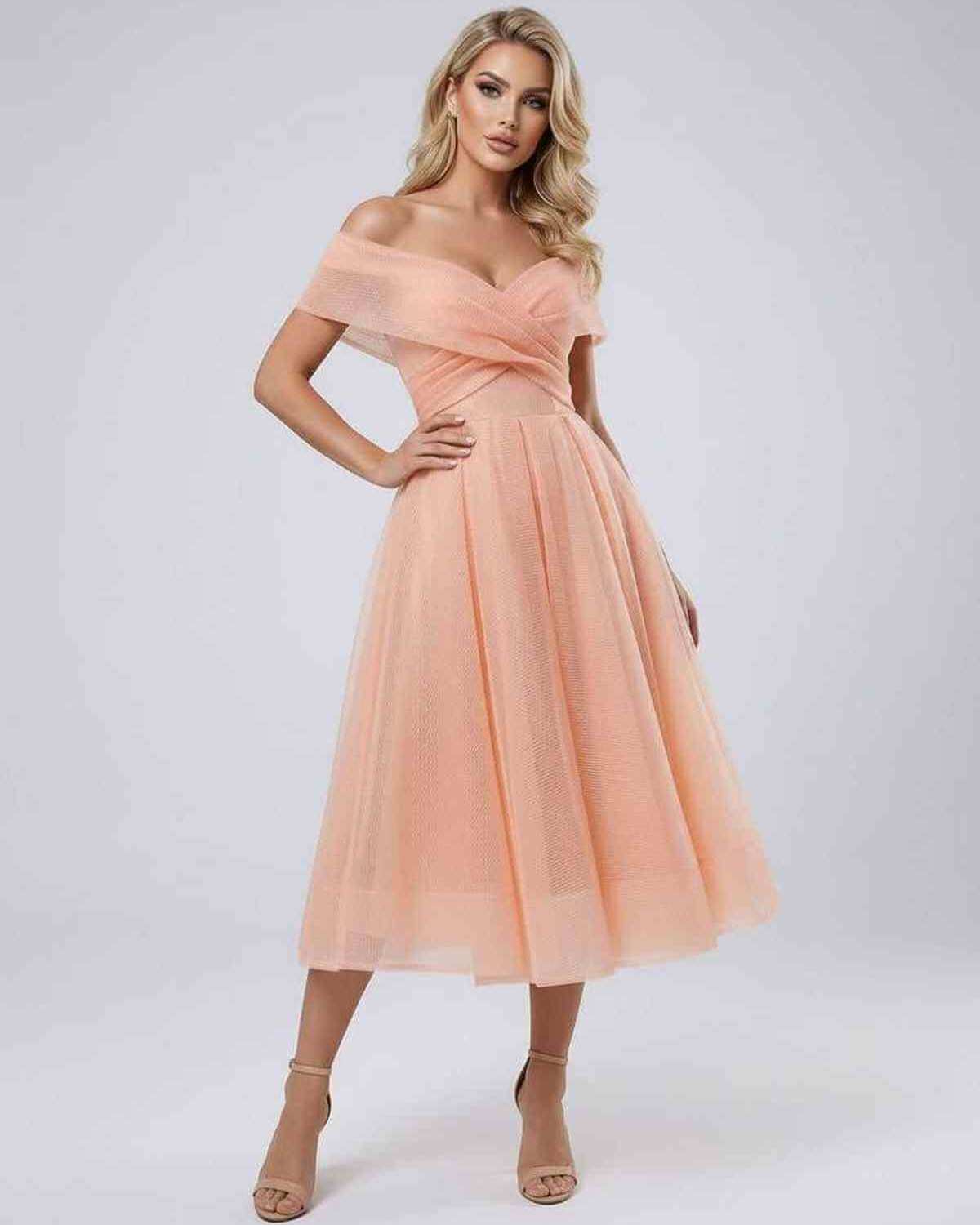 Celeste Midi Dress by Lauven, an elegant off shoulder dress in soft peach, perfect for evening occasions.