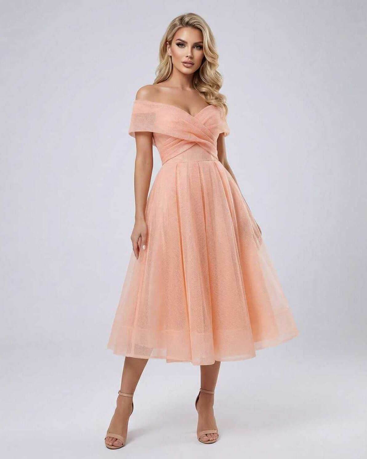Celeste Midi Dress by Lauven featuring elegant off shoulder design and flowing midi length in peach.