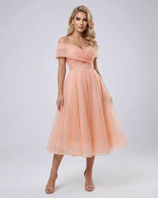 Celeste Midi Dress by Lauven featuring elegant off shoulder design and flowing midi length in peach.