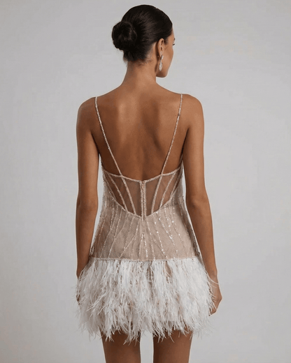Celeste Mini Dress by SLIMONA, featuring sequin tulle and feather tassel hem for a fairycore look.